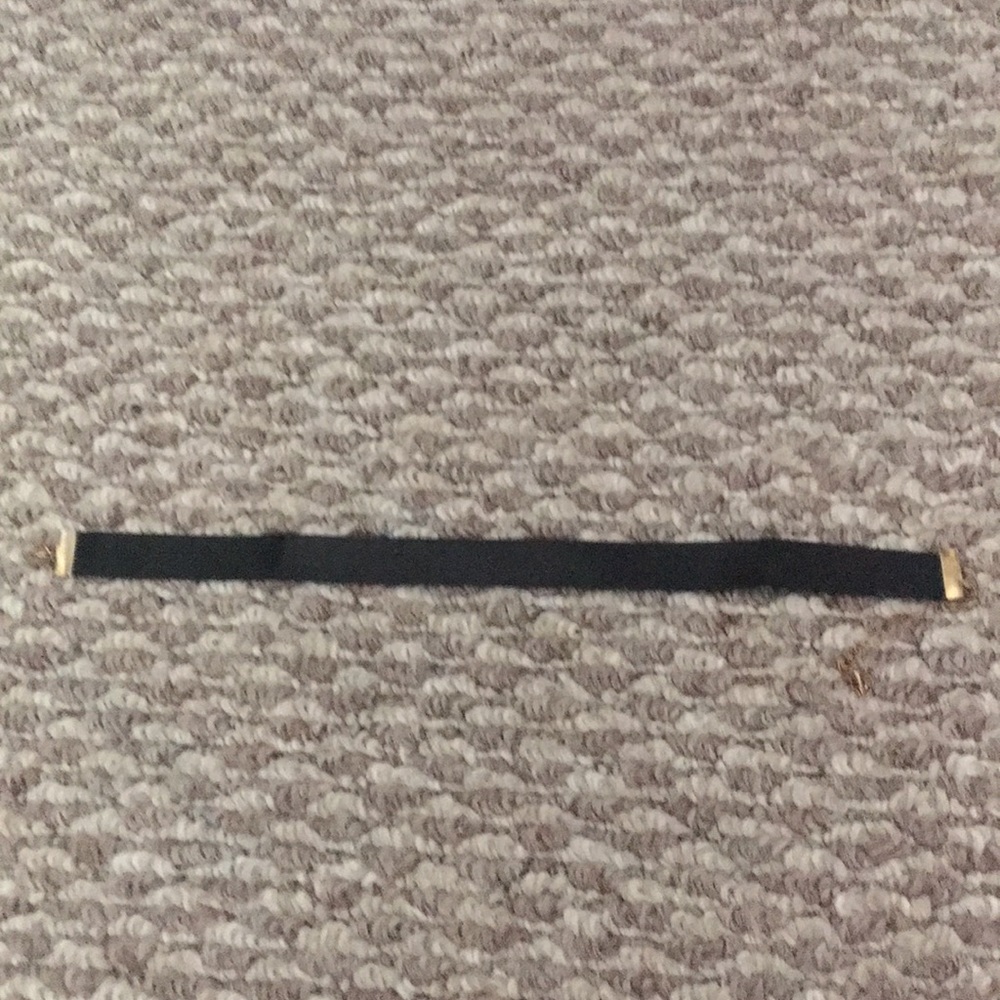 I’m selling a black chocker with gold ends!